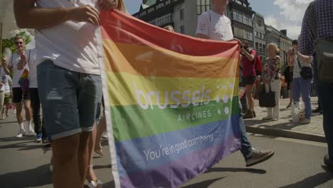 Brussels-Airlines-walking-with-rainbow-flag-and-dragqueen-air-hostess