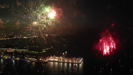 Aerial-view-panning-around-fireworks-at-the-Navy-pier,-night-in-Chicago,-USA