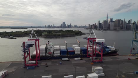 Cargo-ship-being-loaded-in-Brooklyn-Navy-Yard,-New-York