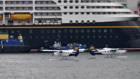 Harbour-Air-Turbo-Otter-Seaplanes-in-Vancouver,-Cruise-Ship-Backdrop