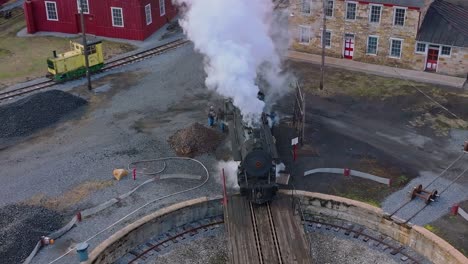 A-Drone-View-of-a-Restored-Steam-Engine-on-a-Roundtable-Blowing-Smoke-Getting-Ready-for-a-Days-Work