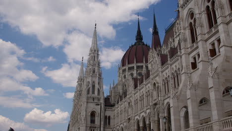 Hungarian-Parliament-Building,-Pan-across-gothic-revival-styled-edifice-facade
