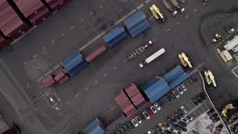 Overhead-of-trucks-and-intermodal-containers-in-an-industrial-shipping-yard