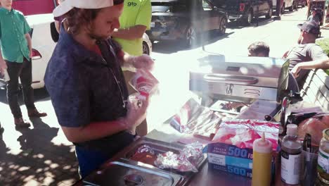 Hot-dog-vendor-selling-food-on-the-street-in-Portland,-Maine