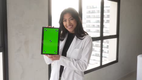 beautiful-asian-woman-holding-tablet-smiling-vertical-2-windows-slow