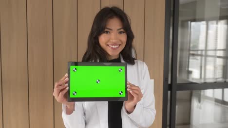 beautiful-asian-woman-holding-tablet-smiling-horizontal-wood-slow