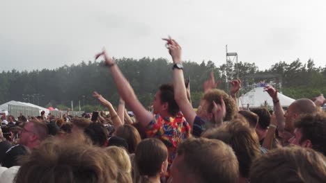 Fans-Jumping-in-a-Crown-during-a-Music-Performance-at-the-Opener-Festival