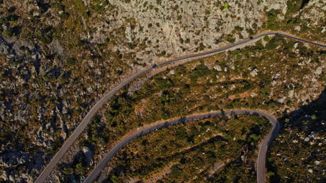Cars-Driving-On-Winding-Mountain-Road-Heading-To-Nus-de-sa-Corbata-In-Mallorca,-Spain