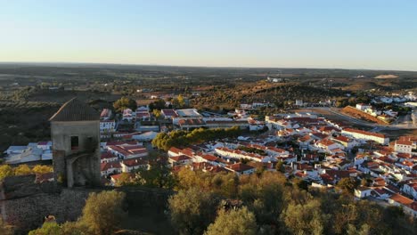 Drone-shot-from-by-a-medievel-tower-on-a-hill-in-Alentejo,-Portugal