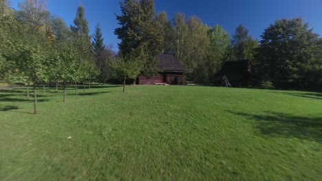 A-historic-wooden-rural-cottage-within-a-European-open-air-museum-during-the-summer-season