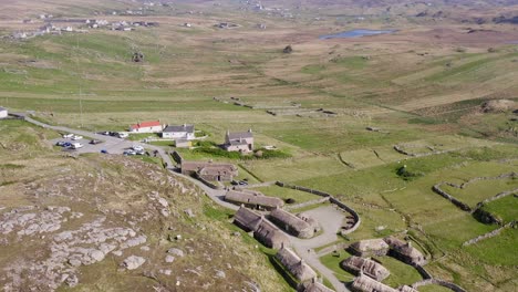 Aerial-shot-of-the-Gearrannan-Blackhouse-Village-on-the-Isle-of-Lewis,-part-of-the-Outer-Hebrides-of-Scotland