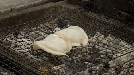 grill-cooking-cuttlefish-on-hot-charcoal-at-thailand-night-market
