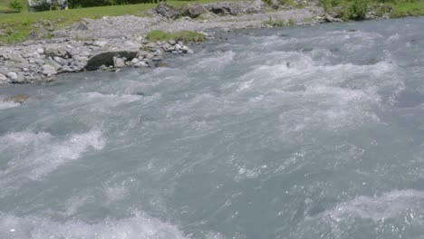 Close-up-Pan-of-Strong-Current-in-Staubifall-Stream,-Switzerland
