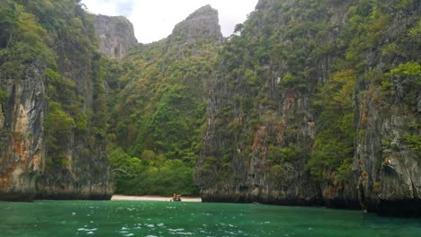 Paradise-Island-with-Private-Beach-on-the-Island-of-Koh-Phi-Phi-Lee-with-Surrounding-Limestone-Cliffs-with-Green-Trees