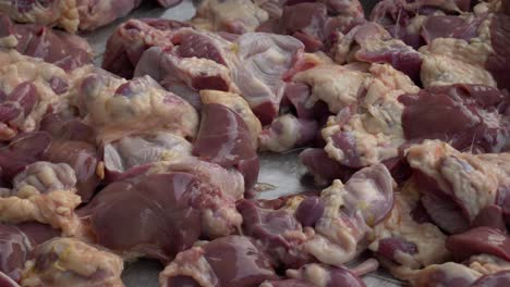 raw-fresh-chicken-gizzard-and-livers-on-counter-ready-for-sale