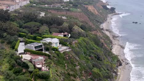 Zuma-Beach-by-Point-Dume-and-Malibu-mansions-of-the-rich-and-famous---aerial-parallax