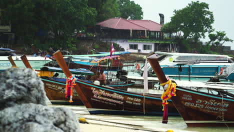 Boats-moored-in-a-bay-and-men-preparing-them