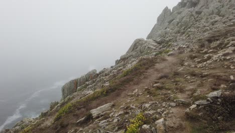 panoramic-view-from-right-to-left-from-Pointe-du-Raz-in-the-fog-in-Brittany,-France-over-the-sea