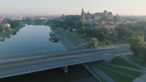 Aerial-Drone-Shot-of-Krakow-Poland-Wawel-Castle-Old-Town-with-the-river-Vistula-at-Sunrise