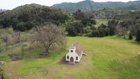 Close-up-panning-aerial-shot-of-the-surviving-church-from-the-2018-Woolsey-Fire-that-destroyed-the-historic-Paramount-Ranch-movie-backlot-in-Agoura-Hills,-California