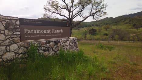 Gimbal-close-up-panning-shot-of-the-entrance-sign-to-the-remnants-of-Paramount-Ranch-in-Agoura-Hills,-California