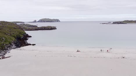 Ascending-drone-shot-of-Bosta-beach-on-the-Isle-of-Great-Bernera,-near-the-Isle-of-Lewis-on-the-Outer-Hebrides-of-Scotland