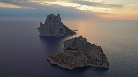 Scenic-View-Of-Island-Es-Vedrà-In-Ibiza,-Spain-At-Sunset---aerial-shot