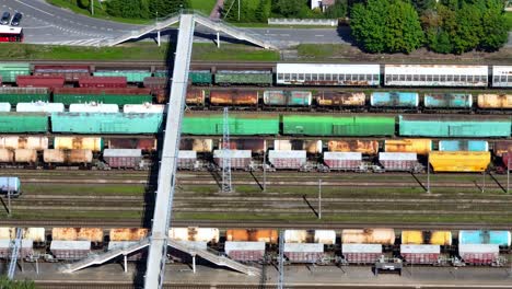 Aerial-view-of-various-purpose-train-wagons-and-tankers-standing-at-the-train-station