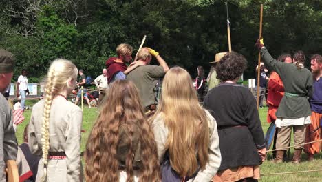 Young-maidens-watch-a-Viking-re-enactment-of-a-battle-at-Waterford-Ireland