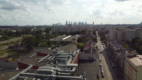 Drone-video-of-warsaw-city-with-skyline-in-the-far-from-praga-district-of-Poland