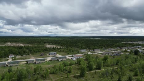 A-moving-aerial-drone-shot-of-a-residential-area-in-the-Easterville-and-Chemawawin-Cree-Nation-area-during-the-summer-months-and-overcast-season