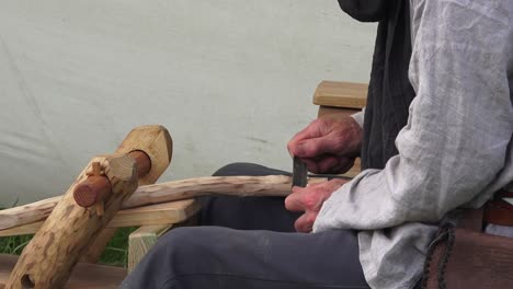Viking-re-enactment-craftsman-displaying-ancient-craft-of-woodworking-at-Woodstown-Waterford-Ireland