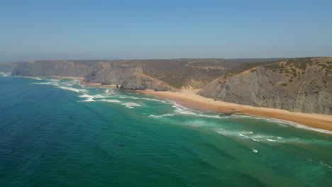 Panoramic-aerial-view-of-the-paradisiacal-beach-of-Cordoama-on-the-Vicentine-coast-on-a-sunny-summer-day,-Algarve,-Portugal