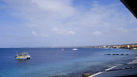 Boat-in-ocean-near-coast-of-Bonaire,-the-Caribbean,-the-Antilles