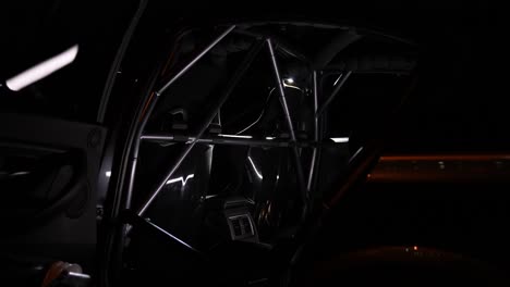 Safety-cage-detail-shot-in-a-professional-racing-car-at-night