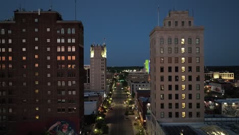 Jackson,-Michigan-downtown-at-night-with-drone-video-close-up-moving-in