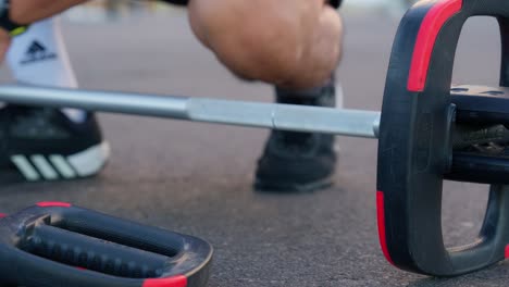 Close-up-of-footsteps-with-sports-shoes-preparing-to-lift-weights