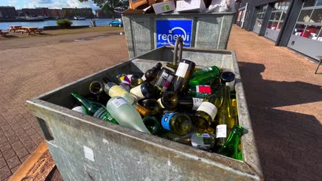 A-bin-full-of-empty-wine-glass-bottles-waits-outside-for-the-garbage-collector