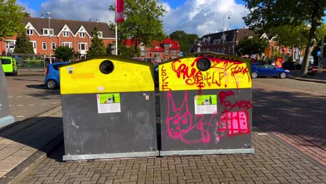Glass-recycle-bins-on-parking-lot-in-Amsterdam-North