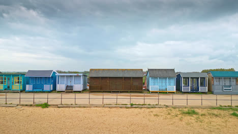 Aerial-views-capture-the-essence-of-Mablethorpe's-beauty,-spotlighting-beach-huts,-sandy-shores,-and-bustling-amusements
