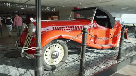 Vintage-car-from-the-40s-at-a-display-in-Vaclav-Havel-Airport-in-Prague,-Czech-Republic