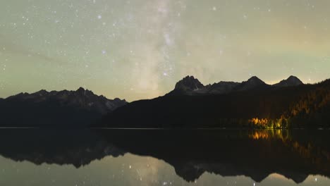 Milky-way-time-lapse-with-picturesque-lake-and-mountain-reflection-in-the-water