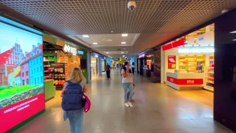 Walking-though-duty-free-shops-at-Riga-International-airport-in-Latvia
