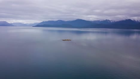 Extreme-Wide-Aerial-Vanderbilt-Reef-with-Dive-Boat-Surrounded-by-Ocean-Lynn-Canal,-Juneau-AK