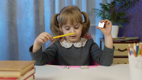 Child-girl-doing-school-homework-teach-alphabet-letters-with-teacher-at-home,-video-call-by-webcam