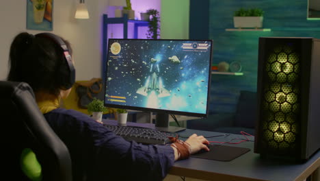 Gamer-playing-space-shooter-video-game-on-powerful-computer