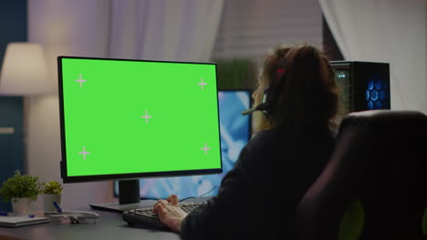 Pro-gamer-playing-virtual-video-game-on-computer-with-green-screen