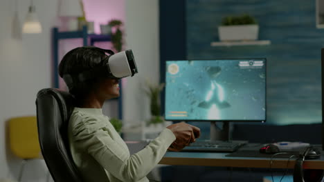 Black-woman-gamer-playing-video-game-at-powerful-computer-using-VR