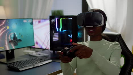 Focused-african-cyber-player-wearing-virtual-reality-headset-during-game