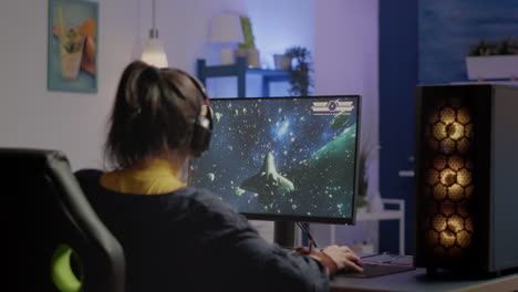 Woman-gamer-puting-headset-starting-to-play-space-shooter-video-game